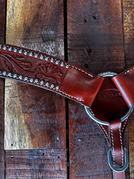 Leather breastcollar with floral tooling accented with silver studs