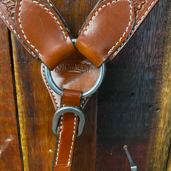 Leather breast collar has floral and basketweave tooling