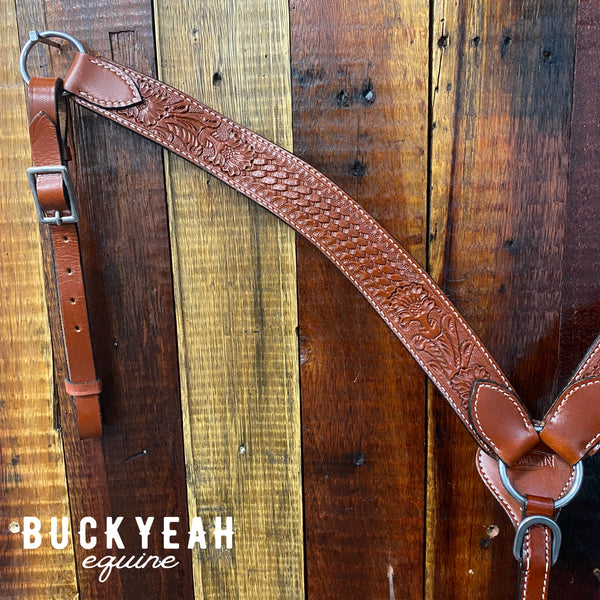 Leather breast collar has floral and basketweave tooling