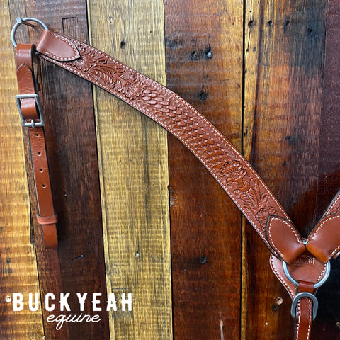 Leather breast collar has floral and basketweave tooling