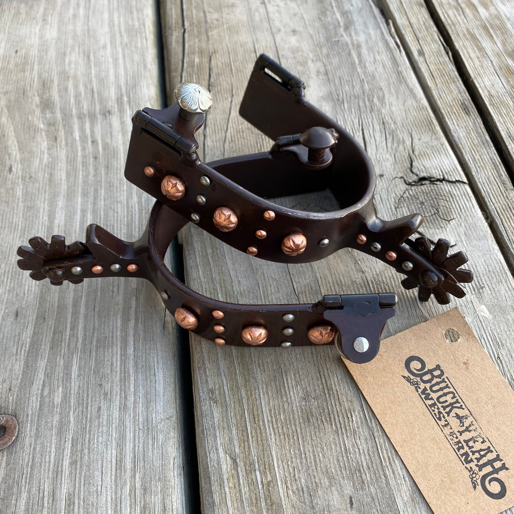 Brown steel spur with engraved copper studs and silver studs